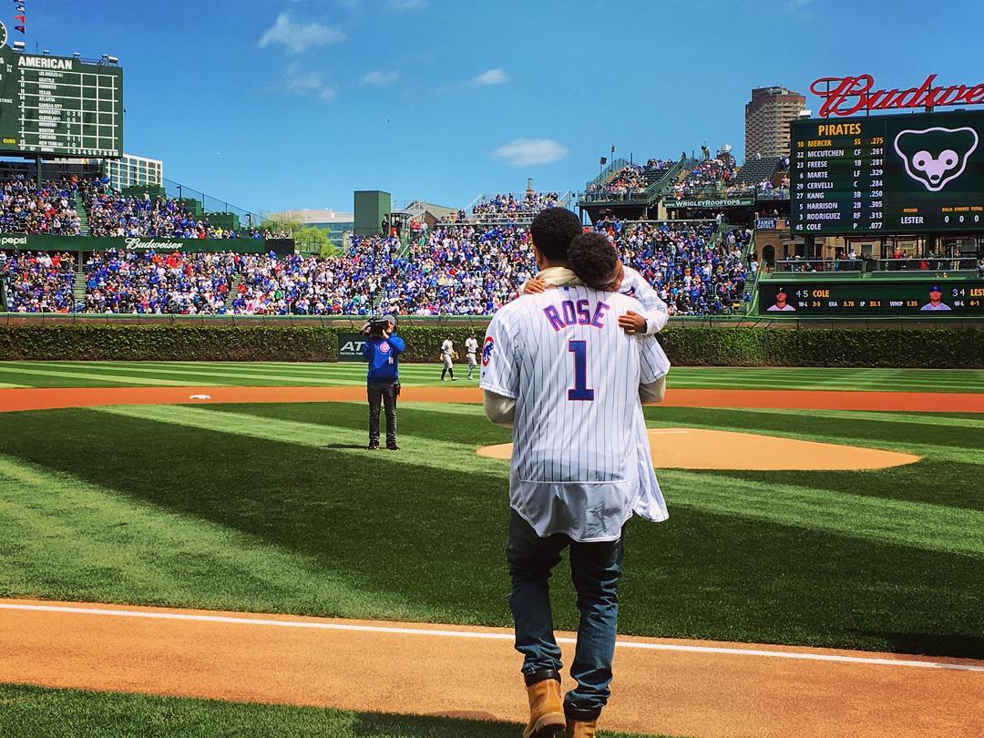 Derrick Rose and Son Throw Out First Pitch at Cubs Game